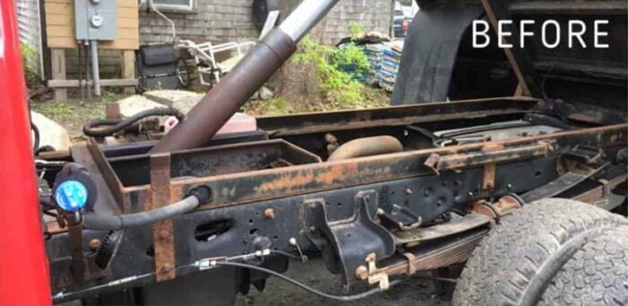 Rusted pickup truck frame rail and crossmembers with flaking surface rust before treatment